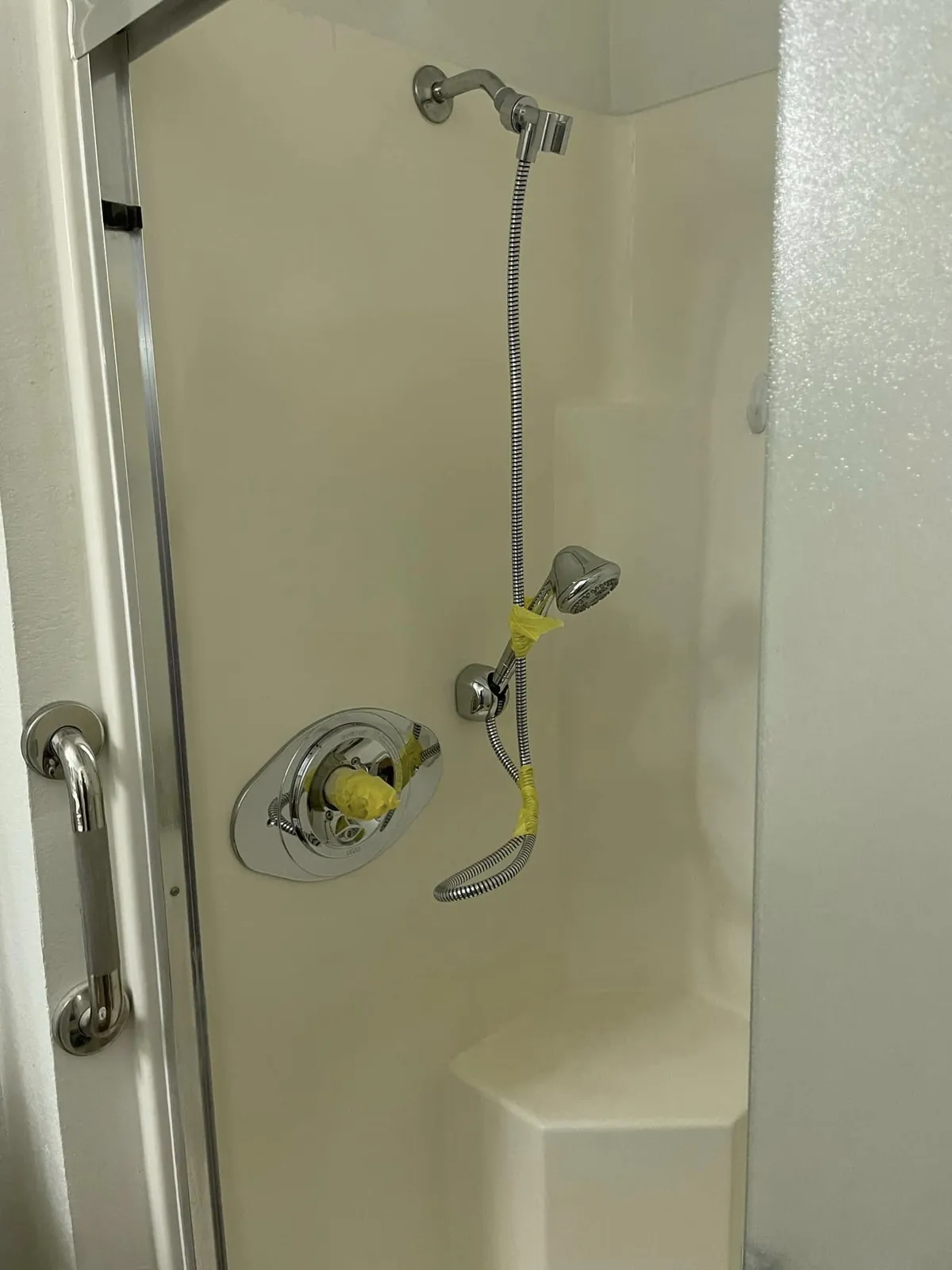 Shower wall and glass door framing during a bathroom renovation